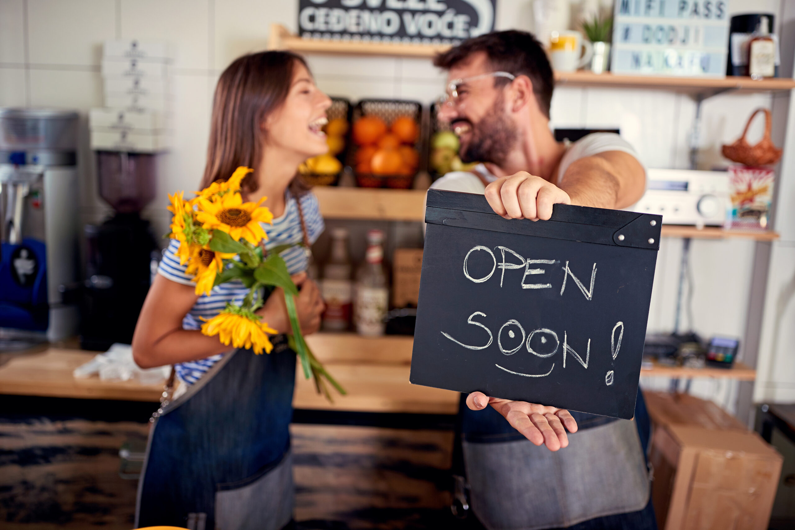 man and woman open small business